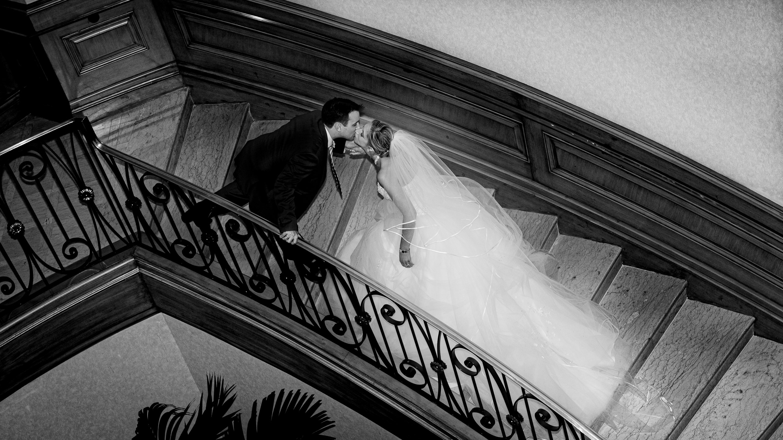 Four Seasons Las Vegas Wedding Photographer editorial couple kissing on staircase