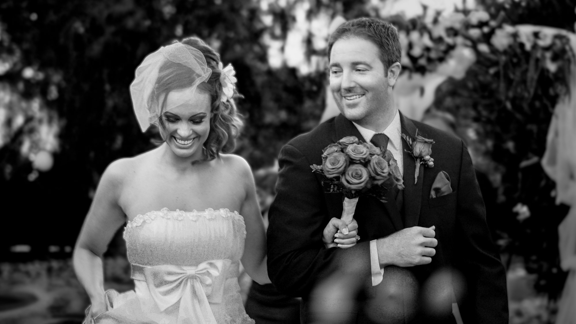 Bride and groom walking together smiling during Napa Valley wedding, cinematic editorial black and white photography