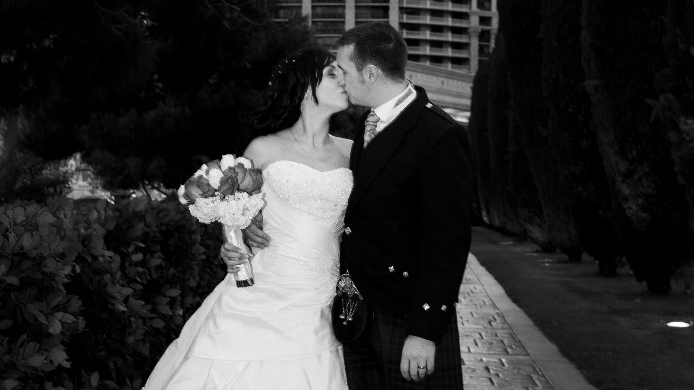 Las Vegas wedding photographer capturing couple kissing at Caesars Palace during destination elopement