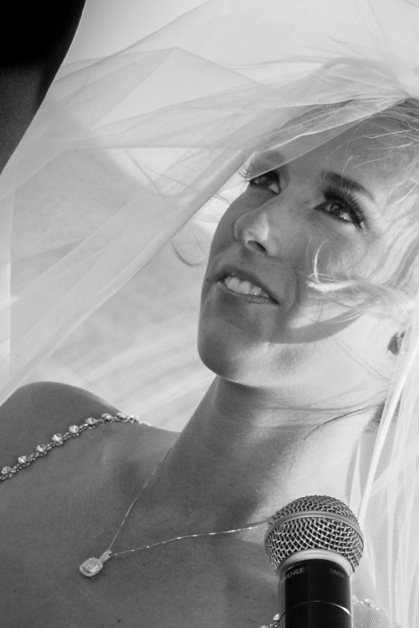 Luxury golf course wedding photographer capturing bride during ceremony in a candid editorial moment