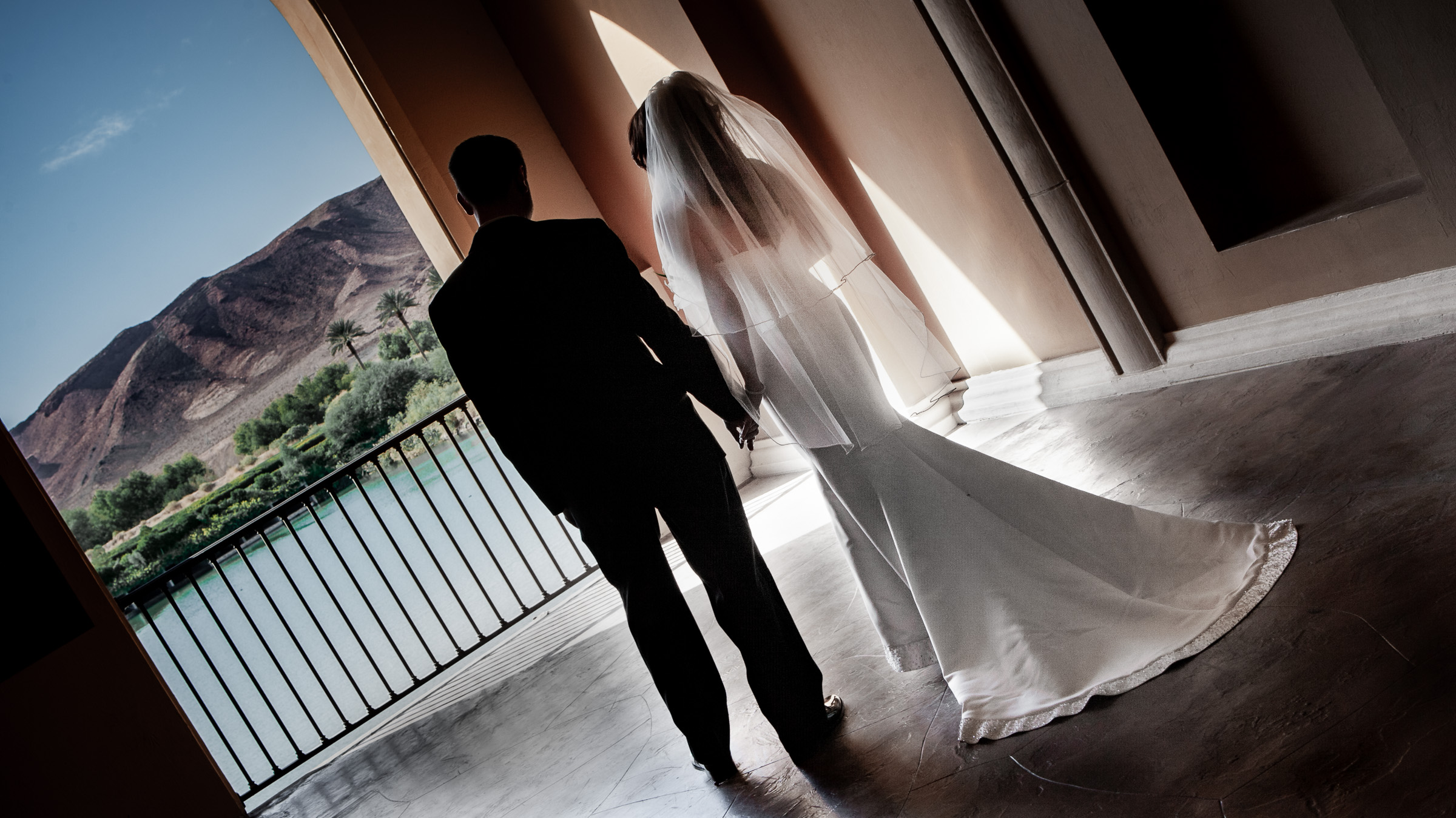 Lake Las Vegas wedding photographer capturing luxury elopement at Hilton Lake Las Vegas Resort with cinematic double exposure of couple and waterfront architecture