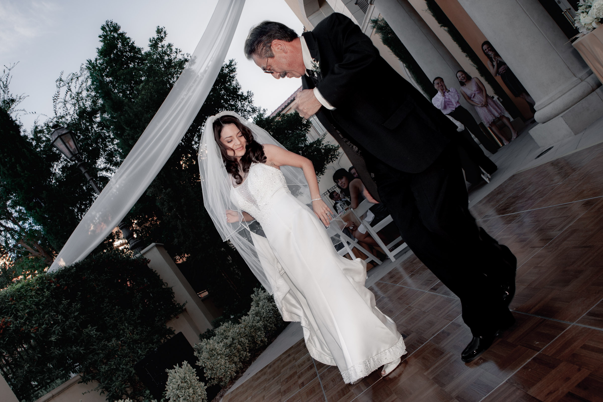 Father and daughter dancing at sunset during an intimate Lake Las Vegas reception