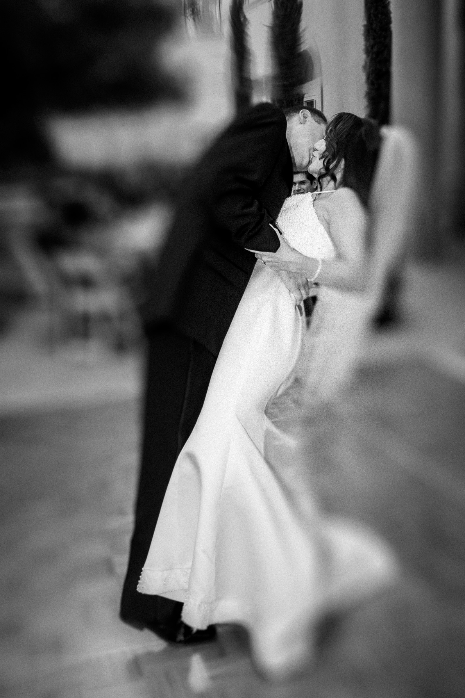 Couple sharing an unexpected kiss during first dance at Lake Las Vegas reception