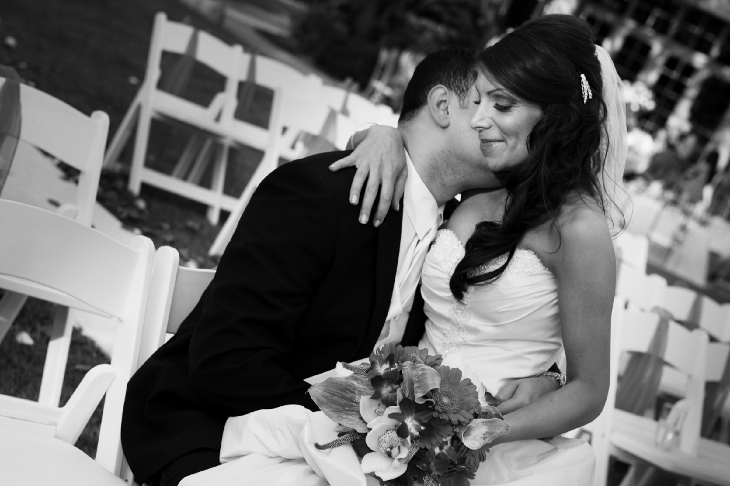 Candid unscripted wedding photography moment of bride and groom embracing during ceremony, Las Vegas
