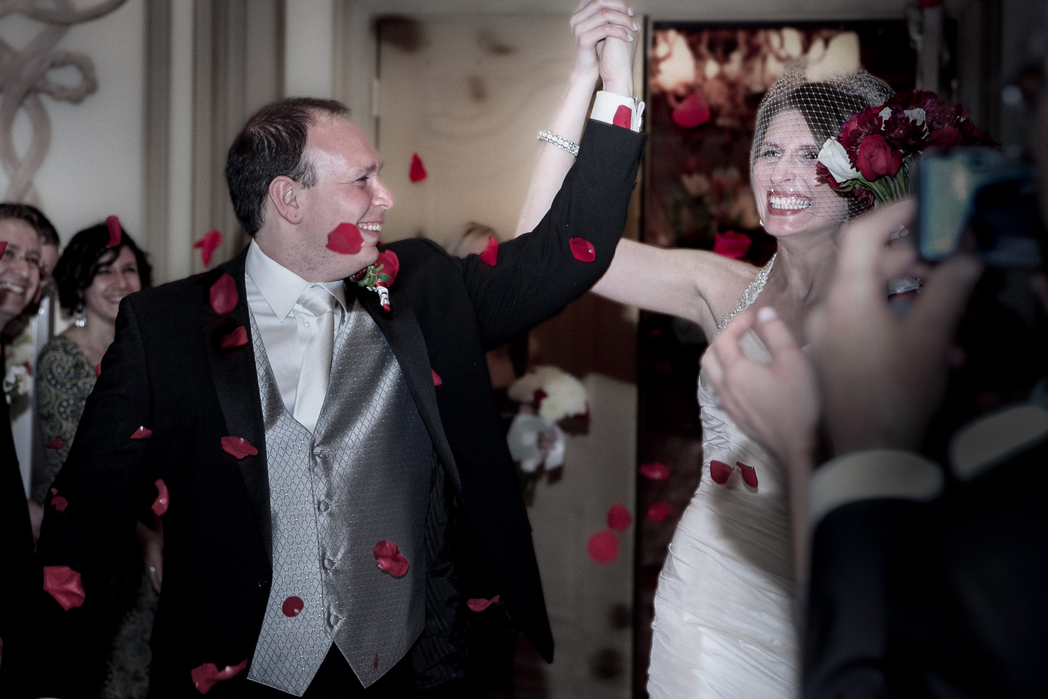 Las Vegas wedding photographer capturing wedding celebration moment with couple at Bellagio