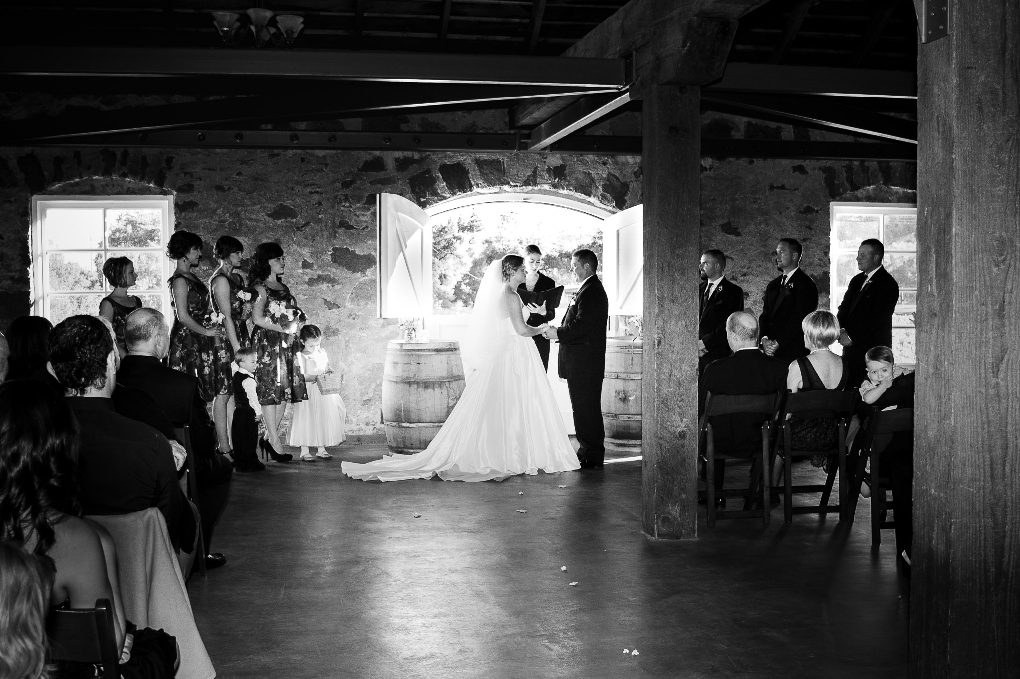 Napa Valley wedding ceremony photographed with an editorial approach capturing guests, setting, and natural light in a refined Wine Country environment