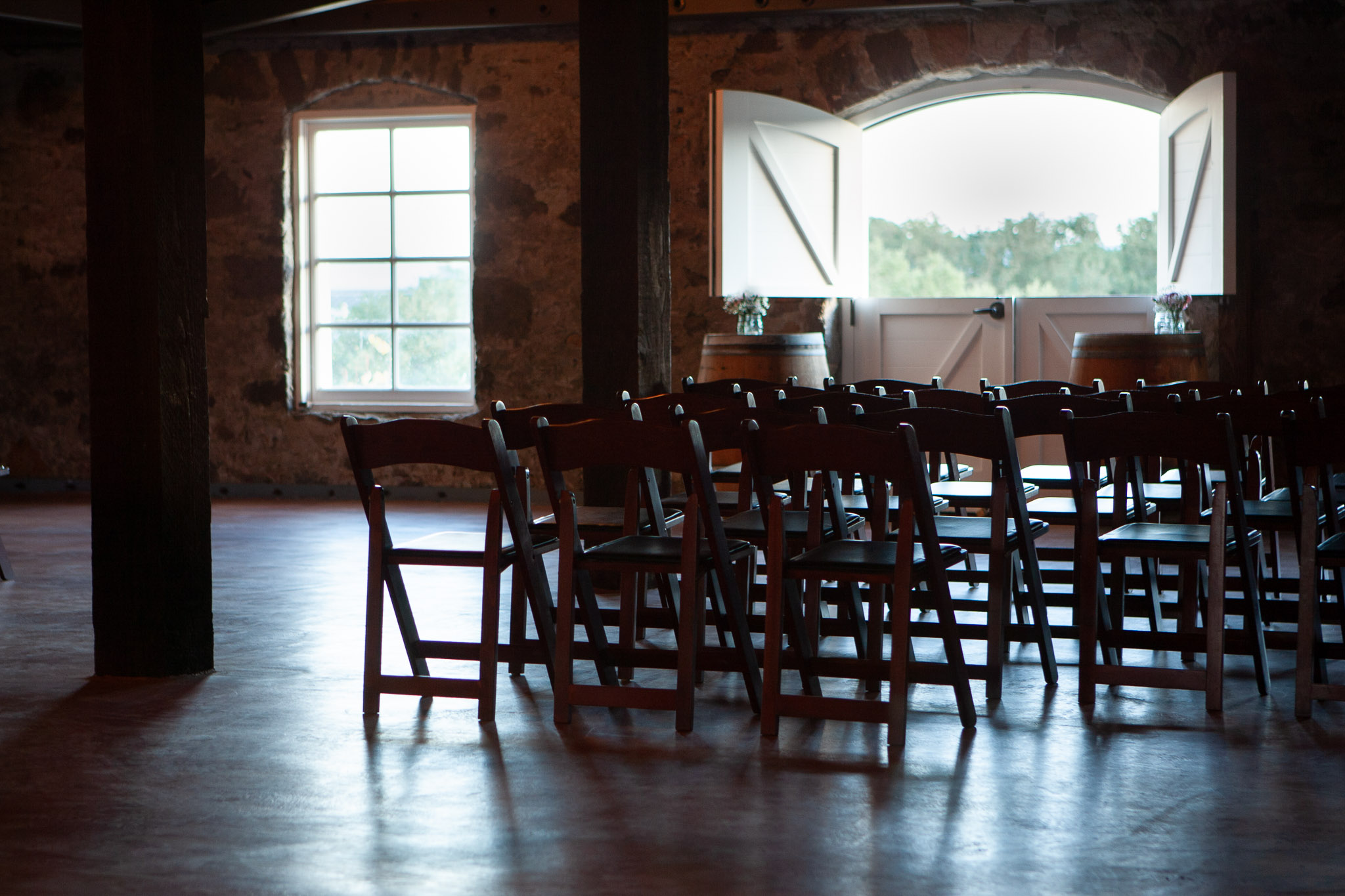 Napa Valley wedding venue interior with elegant ceremony setup and natural light in a Wine Country setting