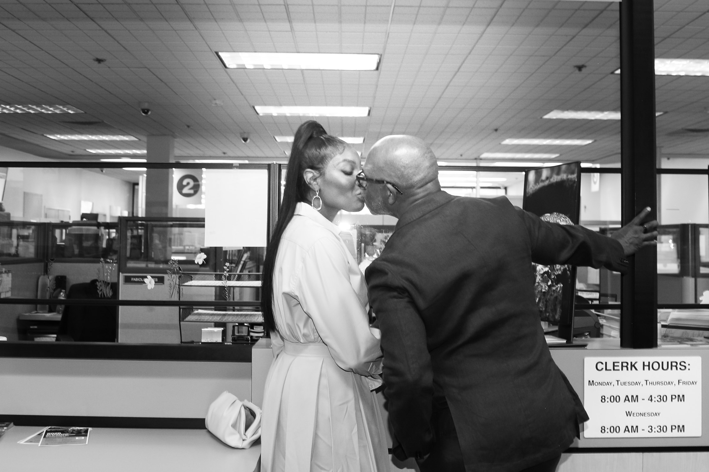 Couple sharing their first kiss after signing their marriage license during a Sonoma County Courthouse elopement.