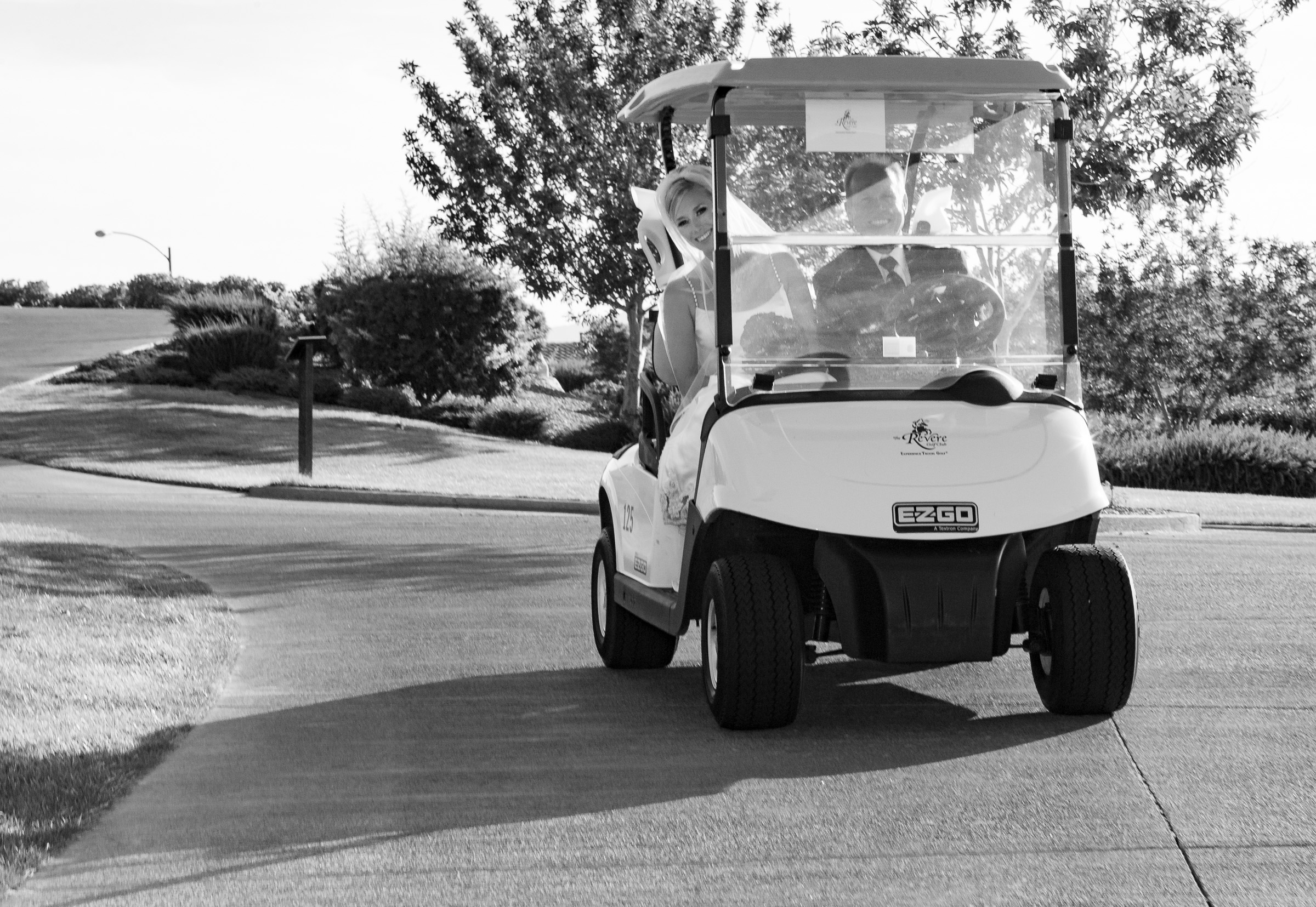 Bride and father in golf cart on their way to ceremony at The Revere Golf Club in Henderson, NV.