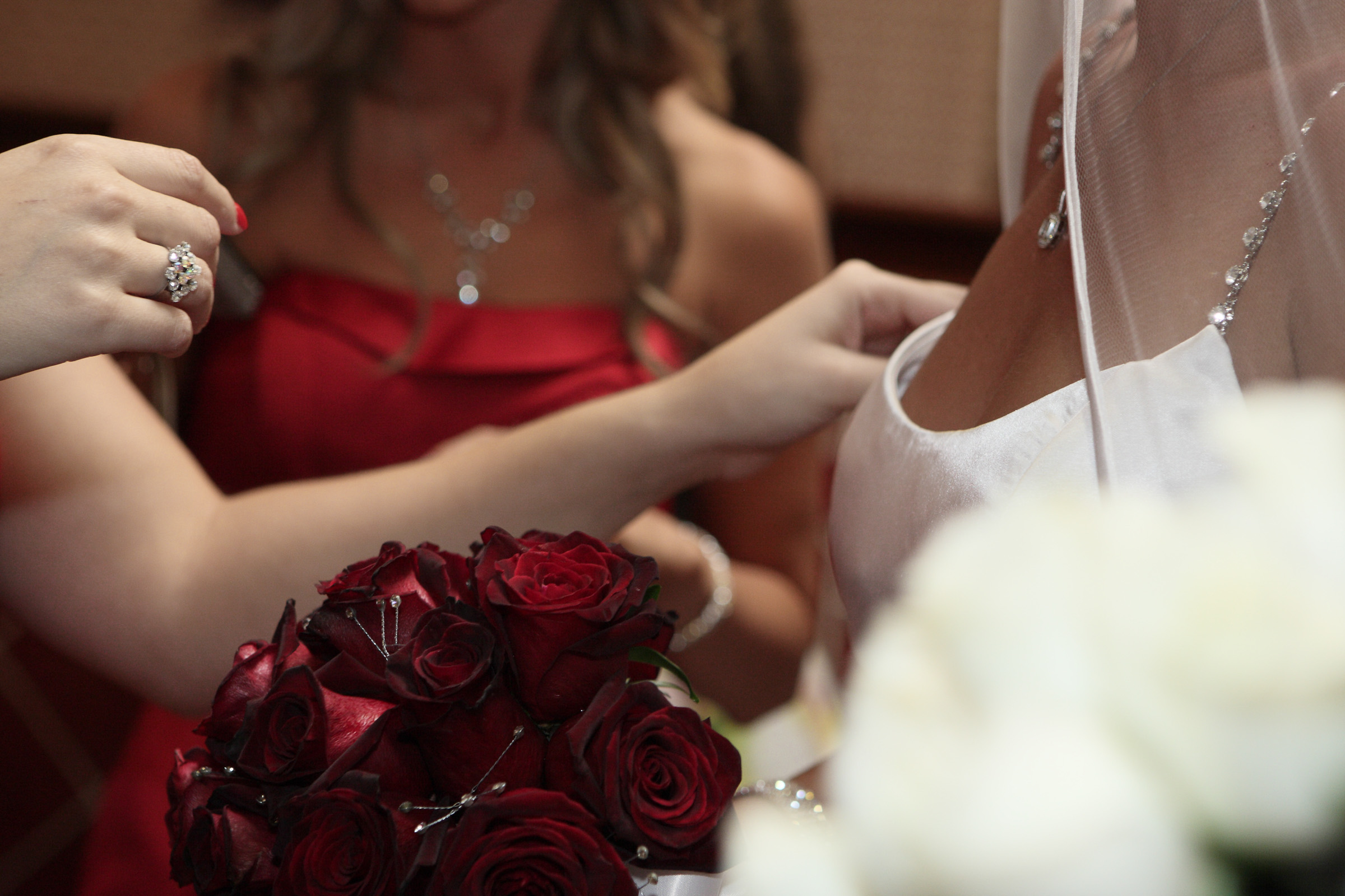 Last minute wedding dress repair at wedding venue.